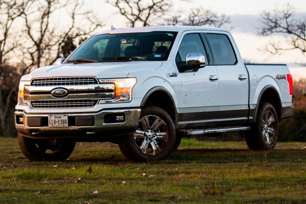 a white truck parked on grass