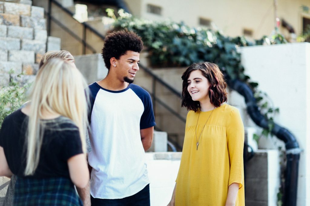 a man and a woman standing outside