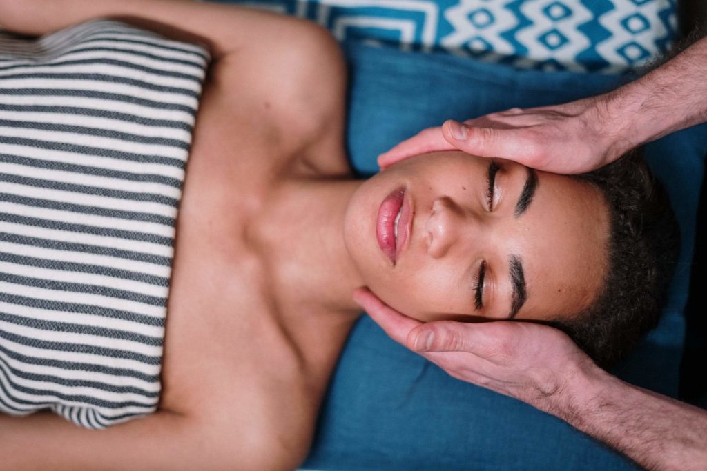 a person lying down with the hand on the chest