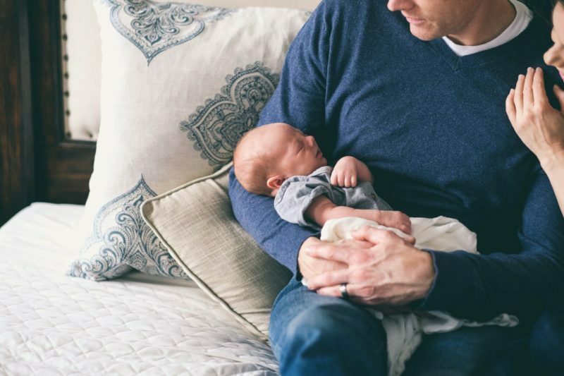 a man holding a baby