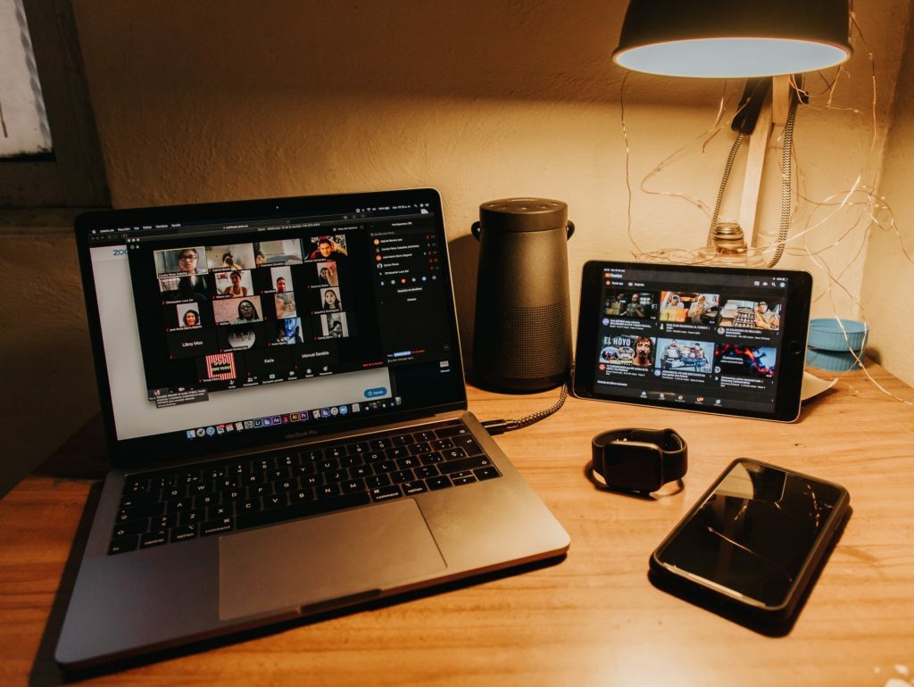 a laptop and a cell phone on a desk