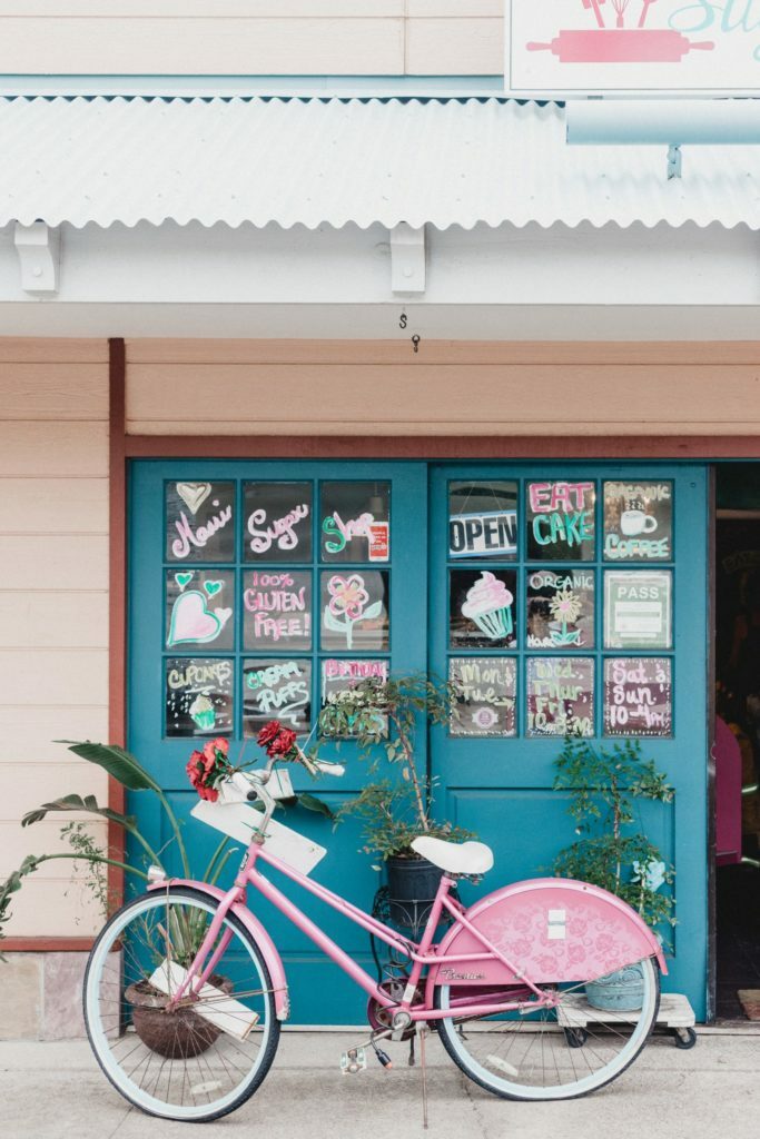 a bicycle parked in front of a shop