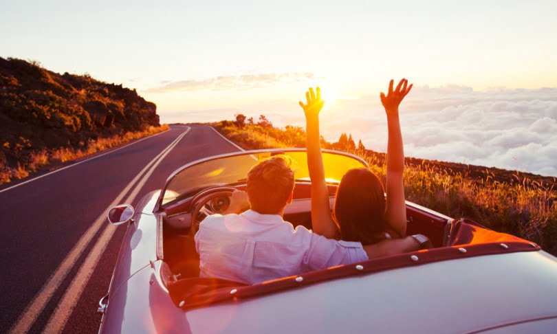 a person in a convertible car