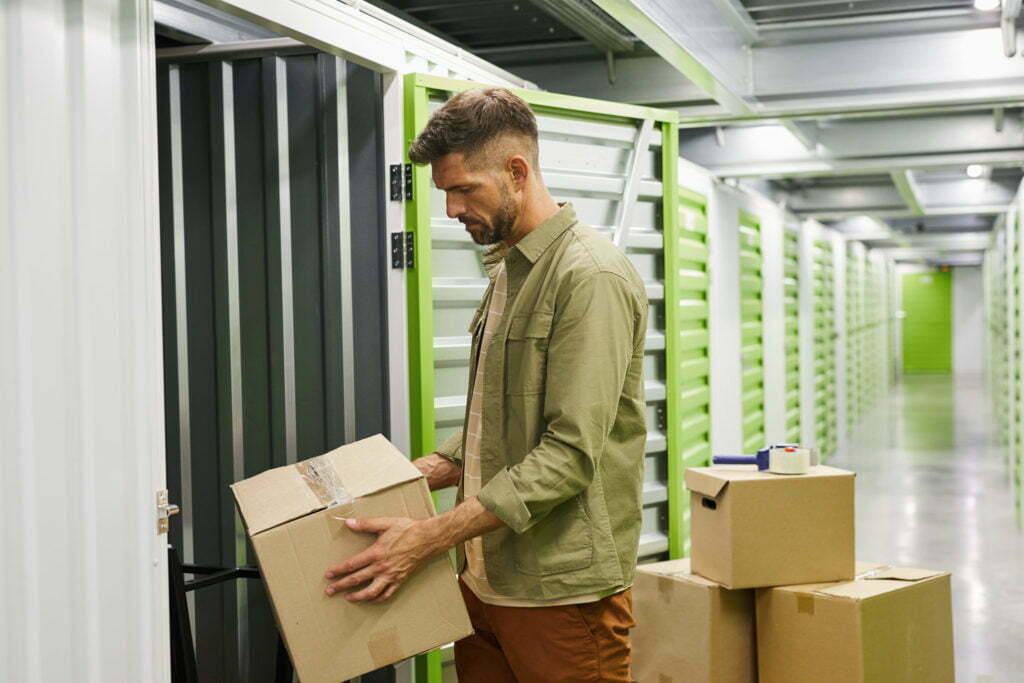a man holding a file in a warehouse