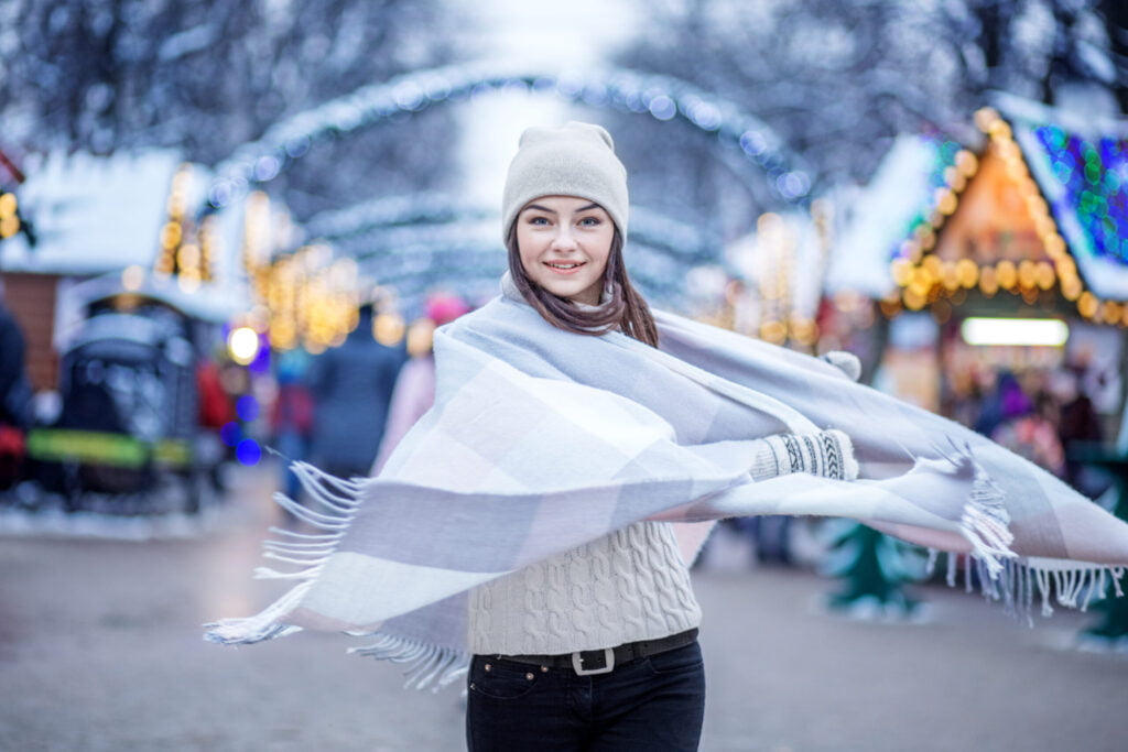 happy young woman wearing a hat and a scarf conce 2022 01 18 23 40 07 utc 1 scaled